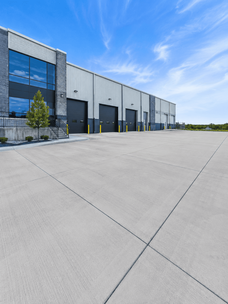 Professionally installed commercial concrete slab at a warehouse facility in Kitchener, Ontario.